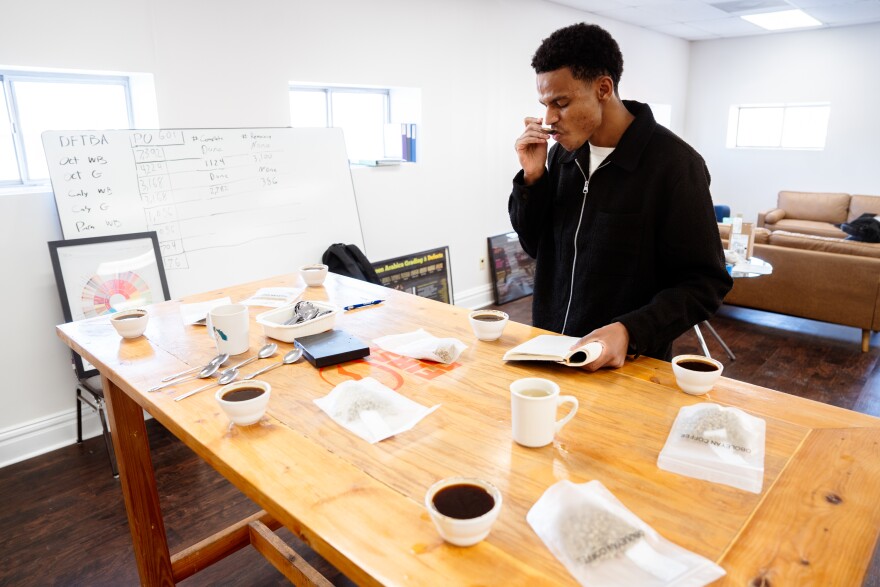 Firaol Ahmed, Moii Coffee cofounder, goes through coffee cupping to test the quality of a particular Ethiopian coffee bean at the First Crack Coffee co-roastery on Wednesday, Jan. 15, 2025, in south St. Louis.