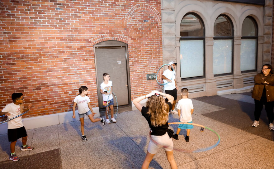 Children play and dance to Funayūrei's music on a warm summer evening at the Landing.