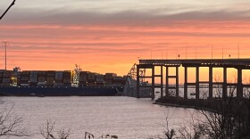 The collapsed portion of the Francis Scott Key Bridge can be seen following the cargo ship Dali's collision on the morning of March 26, 2024.