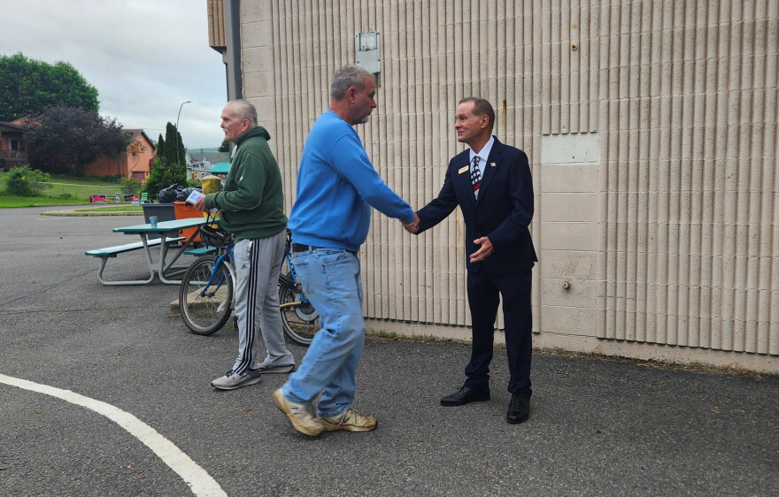 Scranton mayoral candidate Bob Sheridan, who seeks the Democratic nomination, greets a voter at McNichols Plaza Elementary on Tuesday morning.