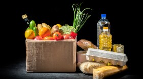 Food donations of different products in a cardboard box