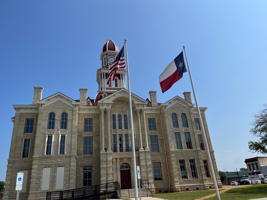 On March 10, 2022, hundreds gathered on the courthouse square as the bell tower clock struck 10 a.m. and Fannin County Judge Randy Moore began the re-dedication ceremony. Among the attendees was Mary Helen Dodson, great-granddaughter of Wesley Clark Dodson, the courthouse’s original architect.