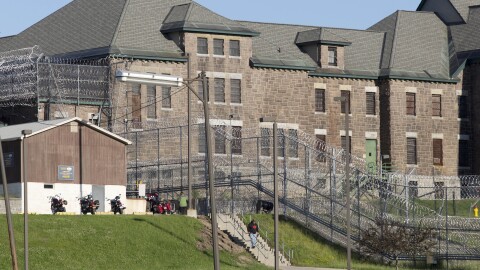 In this June 17, 2015, file photo, an employee leaves the Clinton Correctional Facility in Dannemora, New York.