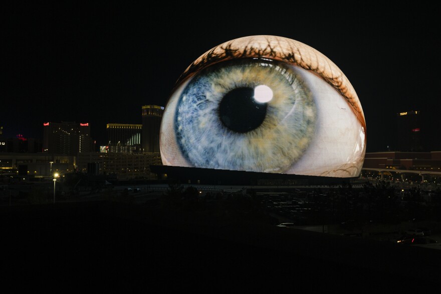 The Sphere — a new music venue in Las Vegas with a 20,000 person capacity — lights up on July 4, 2023.