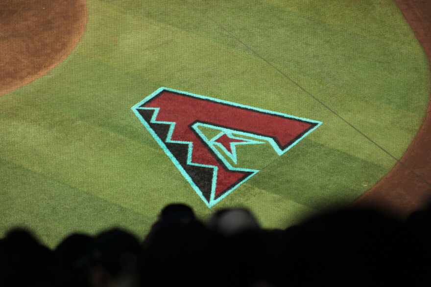 Fans watch a game between the Arizona Diamondbacks and Los Angeles Dodgers at Chase Field in Phoenix on August 8, 2026.