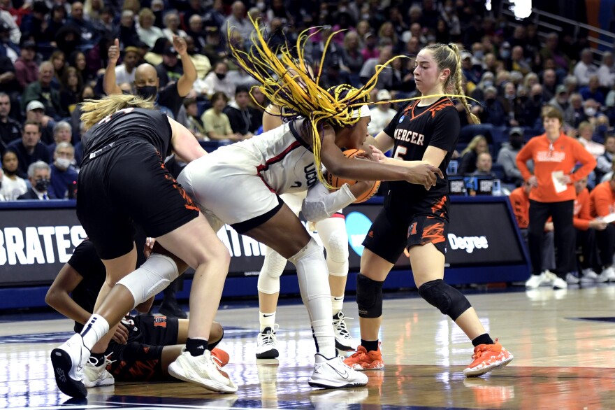 UConn Huskies forward Aaliyah Edwards #3 secures a loose ball during the UConn Huskies first round game of the NCAA Tournament against the Mercer Bears at Gampel Pavilion in Storrs, Connecticut March 19, 2022.