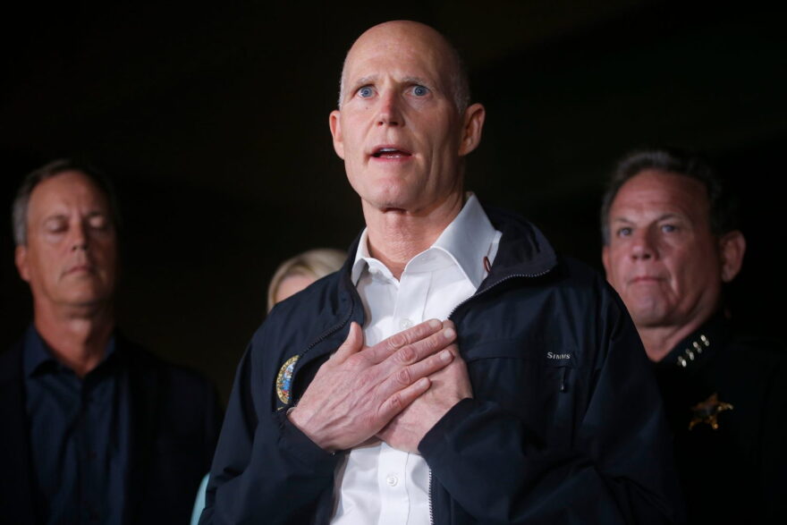 In this Feb. 14, 2018, file photo, Florida Gov. Rick Scott speaks during a news conference in Parkland, Fla. (AP Photo/Wilfredo Lee, File)