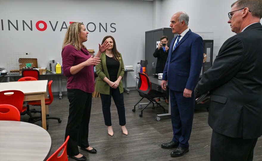 Dr. Jennifer Dessoye and Dr. Marie Patterson from King's College take U.S. Senator Bob Casey on a tour of the college's new building in Wilkes-Barre.