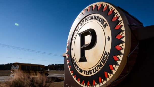 A large welcome to Pembroke sign in the shape of a drum can be seen at the entrance of town in Pembroke, North Carolina on Dec. 12, 2023.