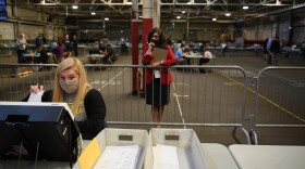 A poll watcher monitors the counting of ballots at the Allegheny County elections warehouse on Nov. 6 in Pittsburgh.