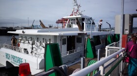 The fast ferry between Bremerton and Seattle, the Rich Passage 1, docks at Pier 50 in Seattle, which is just south of Colman Dock.