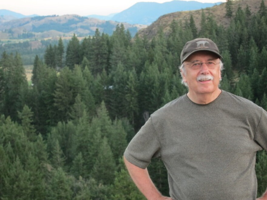 Don Nelson, the editor-owner of the Methow Valley News, with the Methow Valley in the background. The fires this season are the biggest on record in Washington state.