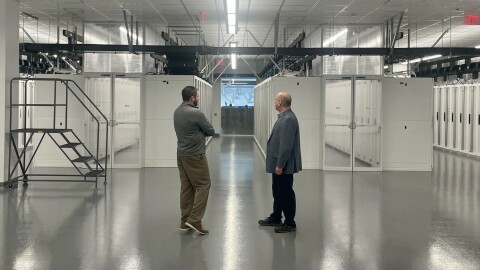 Nationwide Children's Data Center manager Josh Ferrell (left) talks with data center consultant Jim Hayes (right) inside one of the rooms housing servers for the hospital system's data center on April 2, 2026.