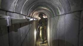 An Israeli army officer gives journalists a tour of a tunnel allegedly used by Palestinian militants for cross-border attacks. (Jack Guez/AP)