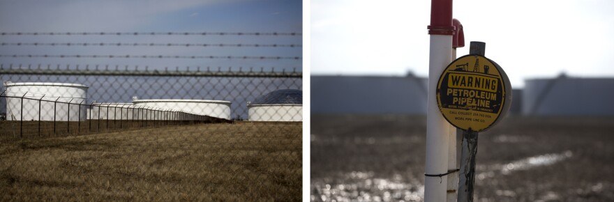 Barbed wire and warning signs surround the oil tank facilities.  (Jan. 24, 2017)