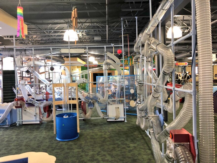 A bewildering maze of hollow plastic pipes charged with air that can keep balls aloft enchants children.