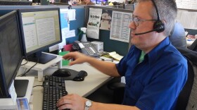 Alex Williams, an operator for 211, King County's information line for emergency food or shelter.