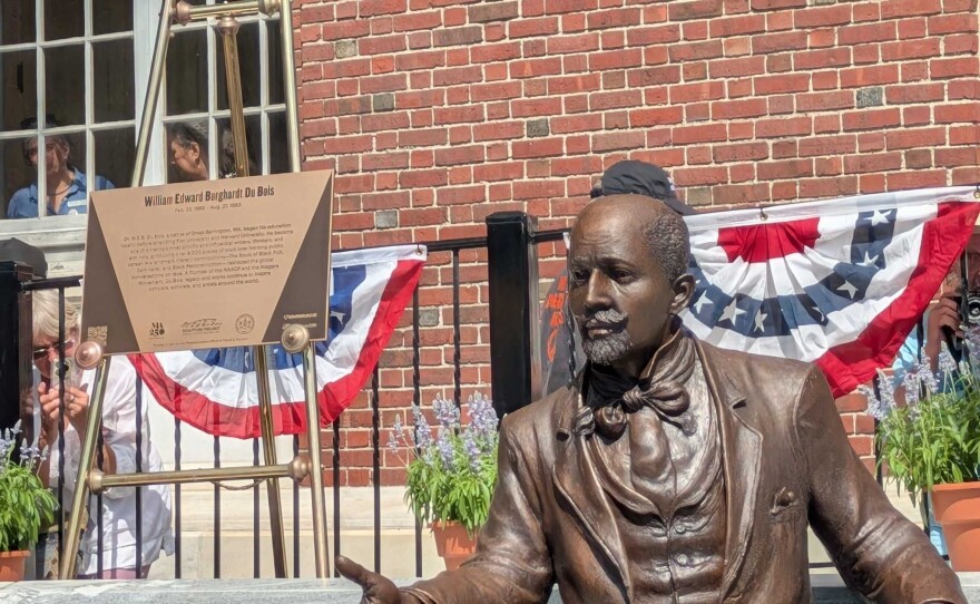 In Great Barrington, Mass., hundreds came out to witness the unveiling on July, 18 2025 — and sit next to — a new bronze sculpture of W.E.B. Dubois, the scholar and co-founder of the NAACP who who was born in the town in 1868.