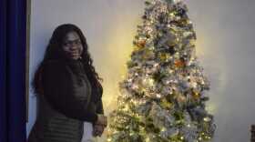 Kettly Gregoire by her Christmas tree on Dec. 15, 2024.