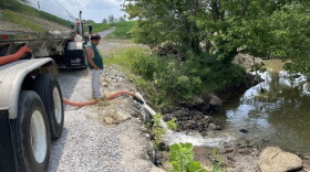Thousands of gallons of water are being dumped by tanker trucks into Crooked Creek, which flows into Marion’s remaining water supply.