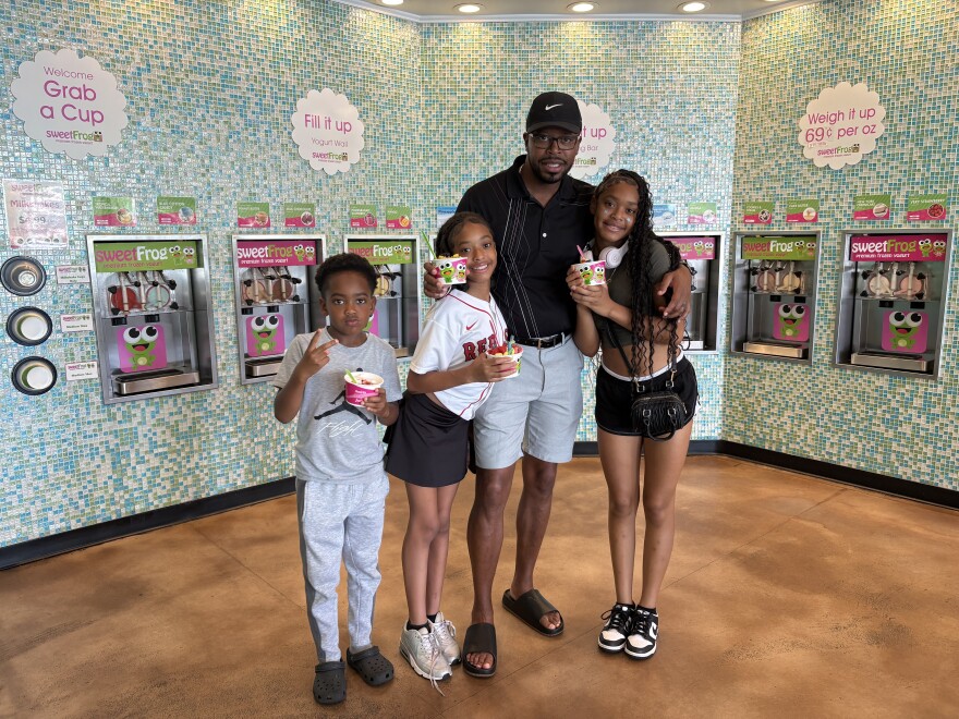 Smart Start of Forsyth County Special Projects Director Juwon Crowell with his family (right to left) Harmoni 15, Sereniti 11, and Roial 8.