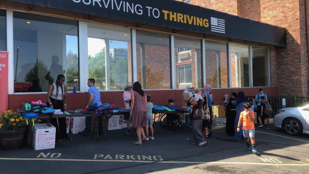 Immigrant families sort through clothes at Thrive Spokane's recent "back-to-school" celebration event.