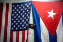 FILE - A U.S. and Cuban flag hangs on a wall in Havana, Cuba, Monday, Jan 11, 2021.