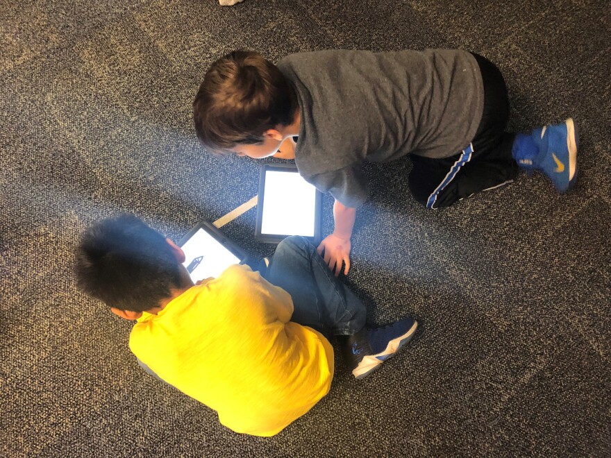 Shawnee Mission students use iPads to take notes during a Project Lead The Way class.