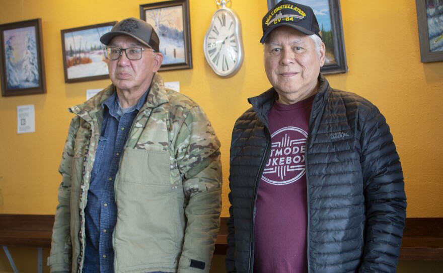 Alaska Native Veterans Association members Darrell Frank (left) and Hugh Walker stand inside the River City Cafe in Fairbanks.  Frank - a former Army paratrooper - was part of an aborted deployment to Iran in the 1970s, while Walker served in the Navy during the same period.