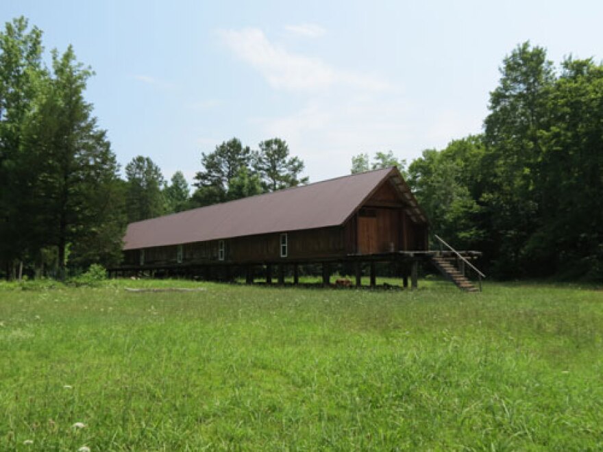 Notches in tree logs and minimal bolts support the longhouse constructed like Lincoln Logs. Photo: Kalie McMonagle