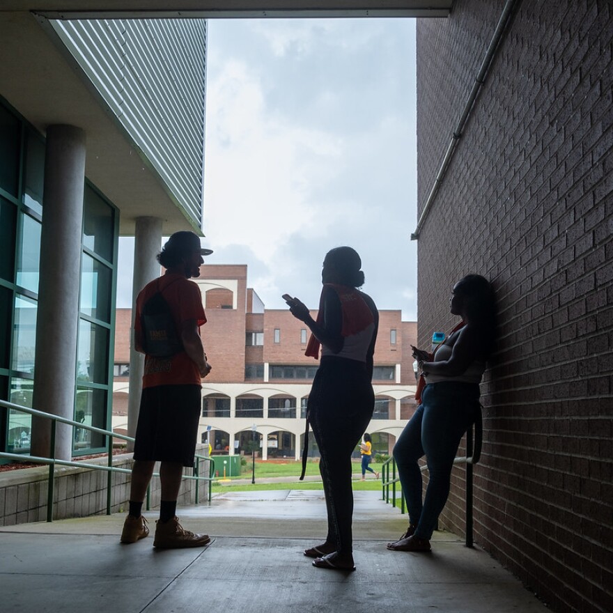 Students stand and chat with each other between classes at Florida A&M University
