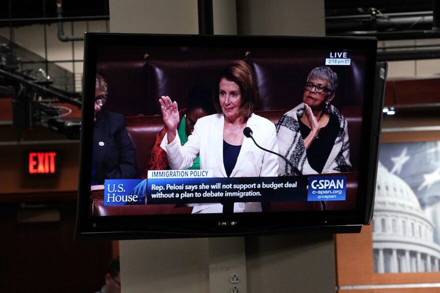 A TV in the Capitol shows House Minority Leader Nancy Pelosi, D-Calif., giving a speech on the House floor Wednesday. Pelosi has been speaking for more than six hours to protest the fact that negotiations over the future of the expiring Deferred Action for Childhood Arrivals program have stalled.