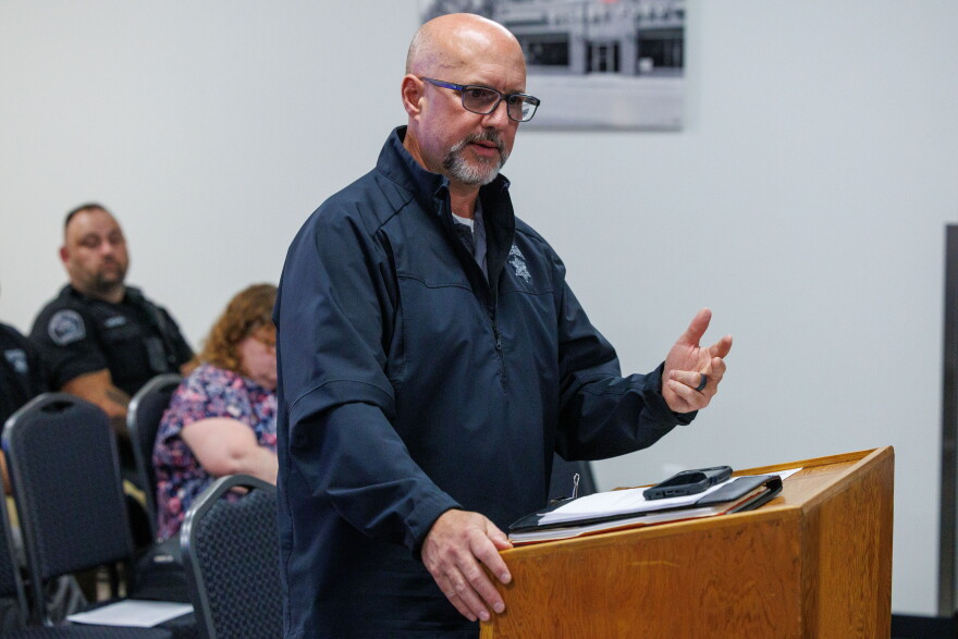 Ingham County Undersheriff Andrew Bouck speaks at podium during the Webberville Village Council meeting on Sept. 28, 2026.