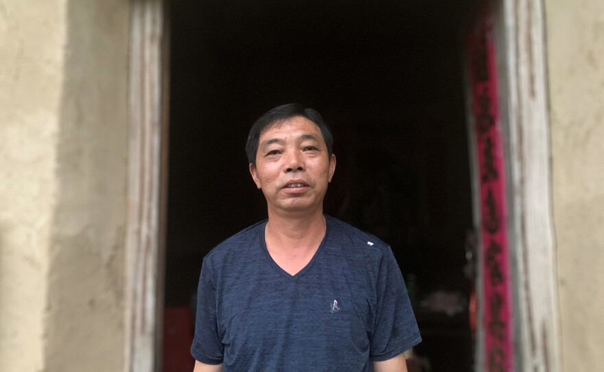 Zeng Hailin stands in front of his dilapidated home. During flash flooding in his Anhui village last month, he evacuated his 80-year-old mother by floating her out in a plastic washbasin.