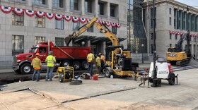 Crews work at the scene of a water main break on North Washington Avenue in downtown Scranton on Monday evening, July 27, 2026.