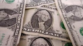 pile of one dollar bills