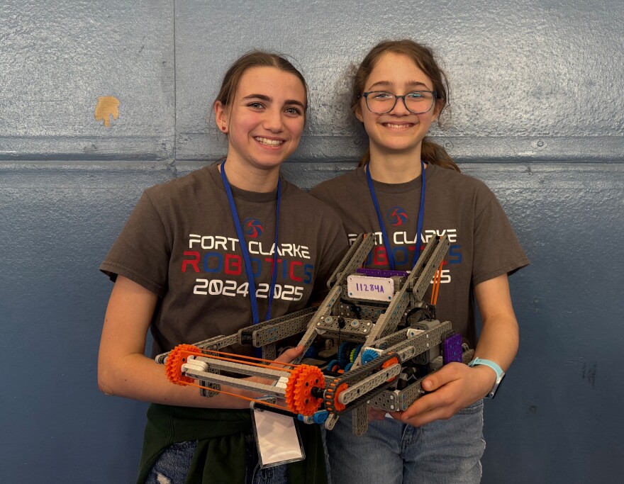 Anneliese Smith, 14, (right) and Paige Bramlett, 13, (left) competed on a robotics team called “The Purple Elmo’s” for Fort Clarke Middle School. (Sara-James Ranta/WUFT News)