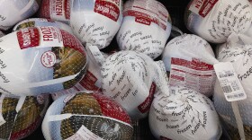 Frozen turkeys sit in a refrigerated case inside a grocery store in Philadelphia, Monday, Nov. 21, 2022. (AP Photo/Matt Rourke)