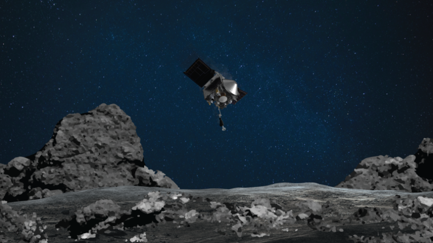 An artist's rendering shows NASA's OSIRIS-REx spacecraft descending toward the asteroid Bennu to collect a sample of the asteroid's surface.