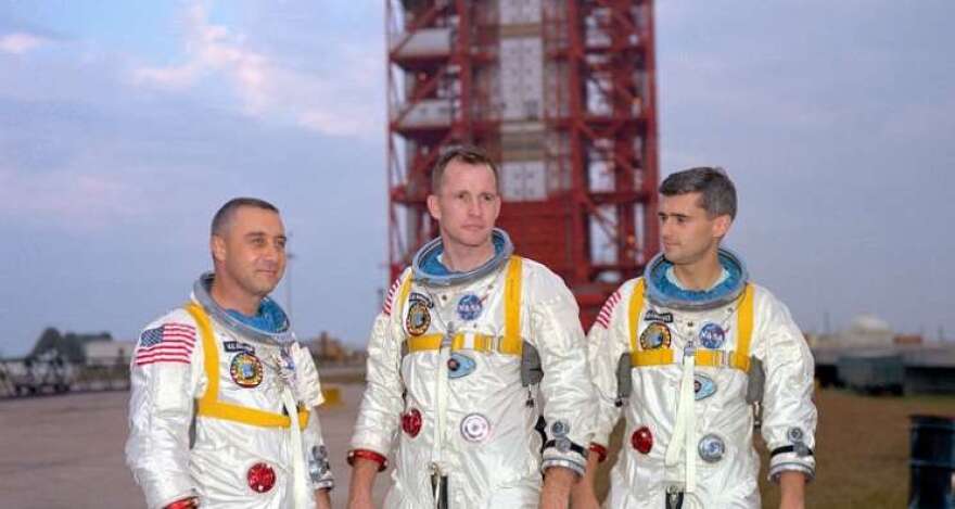 Astronauts (left to right) Gus Grissom, Ed White, and Roger Chaffee, pose in front of Launch Complex 34 which is housing their Saturn 1 launch vehicle. The astronauts died ten days later in a fire on the launch pad. Photo: NASA