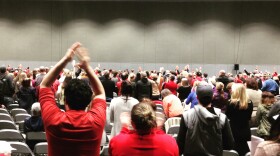 The crowd at a 2016 public meeting in Tacoma rises when asked to stand if they oppose the proposed methanol plant. 