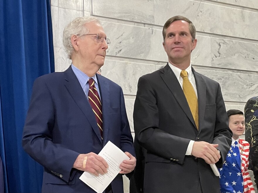 Mitch McConnell and Andy Beshear stand side by side