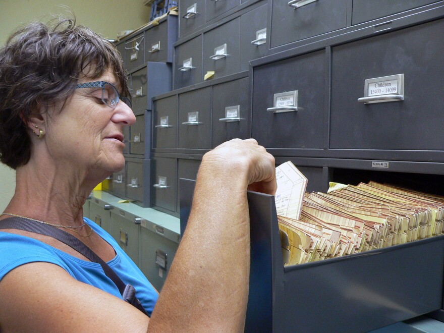 Barbara Cohn, director of the Child Health and Development Studies, looks through participant files collected over 56 years.