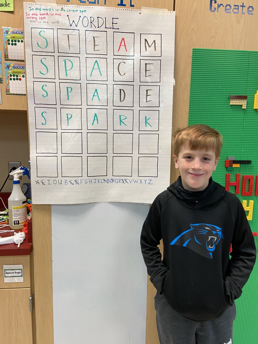 Brooks Conklin, a student in Amy Erb's class at Stallings Elementary, shows off his class's solution to a Wordle she created.