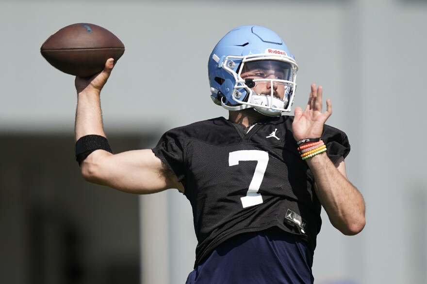 North Carolina quarterback Sam Howell passes during an NCAA college football practice in Chapel Hill, N.C., Thursday, Aug. 5, 2021. (AP Photo/Gerry Broome)