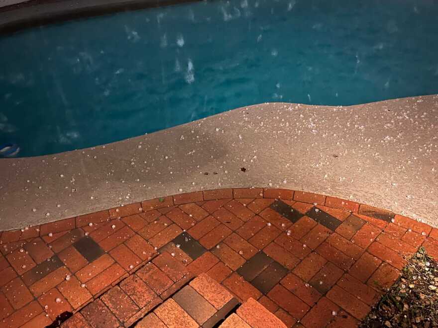 Hail falls in a pool in Tempe on Wednesday, Nov. 19, 2025.