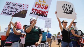 Demonstrators stand at a protest against President Trump's visit following a mass shooting, which left at least 22 people dead, on August 7, 2019 in El Paso, Texas. Protestors also called for gun control and denounced white supremacy. (Mario Tama/Getty Images)