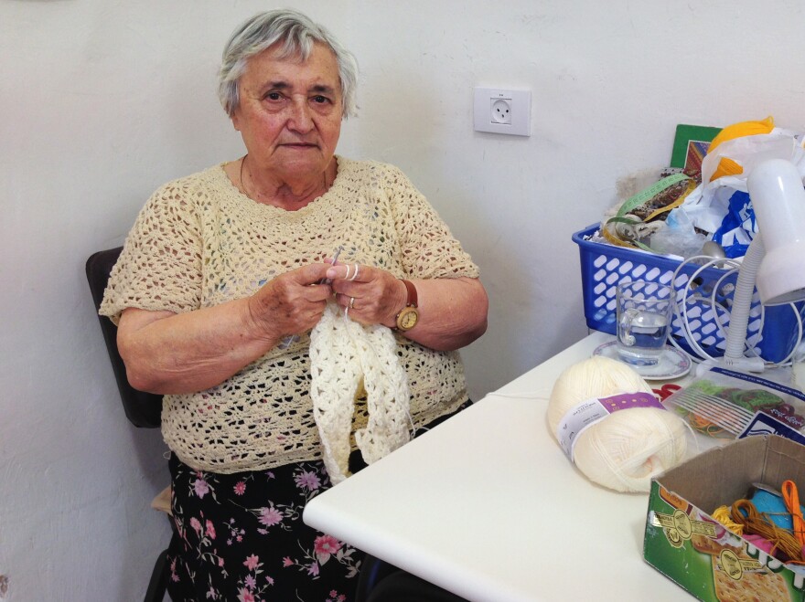 Yulia Feuerman receives about $400 a month from a German government fund. She doesn't receive any financial assistance from Israel because of a law that stipulates that money Germany gave to Israel more than a half-century ago can only be offered directly to survivors who arrived by 1953. Feuerman arrived in Israel a decade later. She's shown here at the Lifeline crafts workshop in Jerusalem.