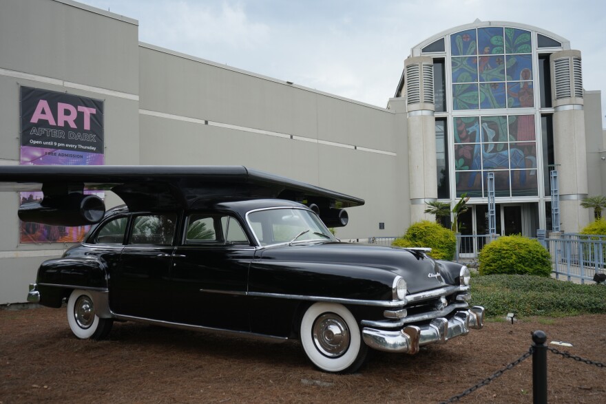 Esterio Segura’s sculpture “Hybrid of a Chrysler” sits outside the entrance of Harn Museum on Sept. 26, 2023. The piece is meant to represent the dreams of Cuban immigrants. (Rae Chan/WUFT News)