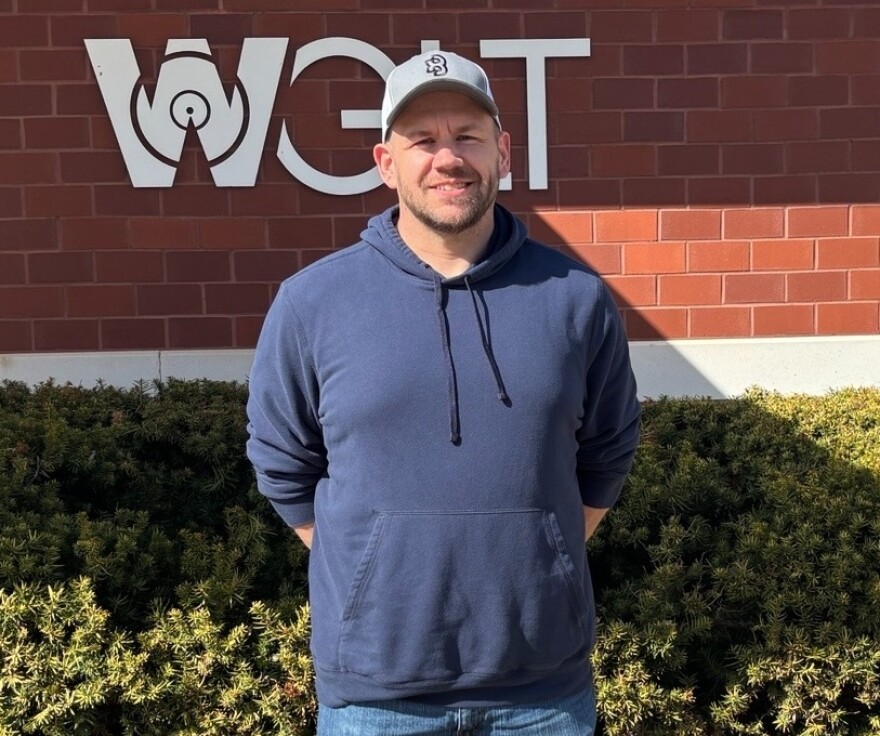 man standing in front of building